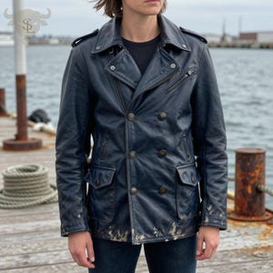 May include: A navy blue leather jacket with a double-breasted design, featuring multiple pockets, button closures, and a zipper detail. The jacket has a worn, distressed appearance, with visible wear and tear along the edges. A classic outerwear piece.