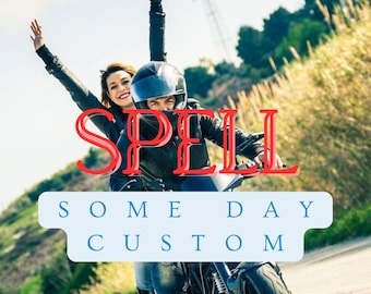 May include: A couple riding a black motorcycle on a sunny day. The word "SPELL" is in red over the couple, and the words "SOME DAY CUSTOM" are in a blue banner below.