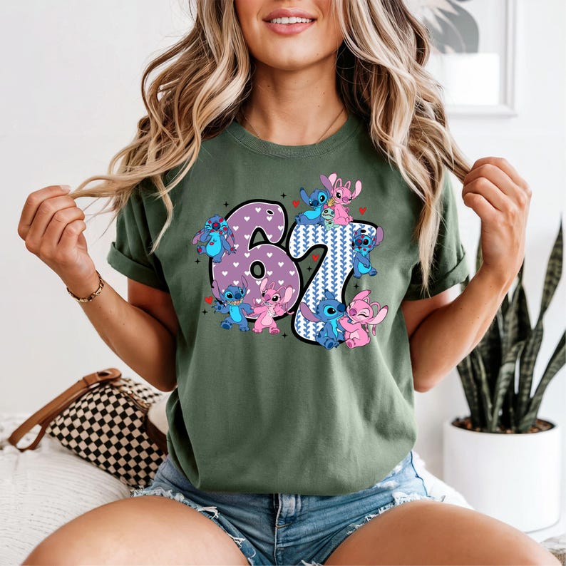 A woman wearing a green t-shirt with a graphic of the characters from the Disney movie "Stitch" and the number "67" printed on it.