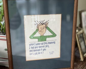 Framed Vintage Ziggy Cross-Stitch Art with Humorous Quote