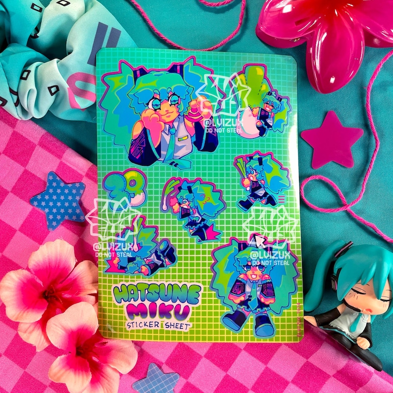 May include: A sticker sheet featuring Hatsune Miku, a popular Japanese virtual singer. The sheet has a green and blue color scheme with a grid pattern. The stickers feature Miku in various poses and expressions. The text "Hatsune Miku Sticker Sheet" is printed on the sheet.