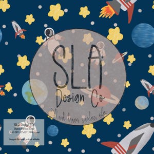 May include: A seamless pattern featuring a navy blue background with white stars, yellow stars, planets, astronauts, and rockets. The text "SLA Design Co. Hand drawn seamless files" is in the center of the pattern.