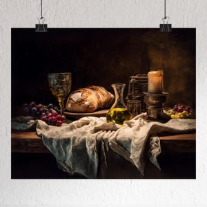 May include: A still life print featuring a rustic table setting. A loaf of bread, grapes, and a glass of wine are arranged on a linen cloth. A small bottle of olive oil and a lit candle add to the ambiance. The color palette is warm and inviting.