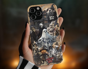 May include: A Halloween-themed iPhone case with a spooky design featuring a ghost, a haunted house, and the text "Fright Night".