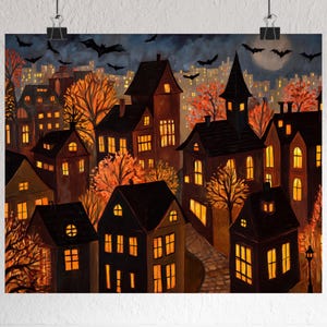 May include: A print of a spooky town at night, featuring dark houses with glowing windows and orange trees. Bats fly in the night sky above the town, with a full moon in the background. The artwork has a Halloween theme.