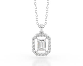 May include: A silver necklace with a rectangular pendant. The pendant features a central emerald-cut diamond surrounded by a halo of smaller diamonds. The chain is delicate and the pendant is centered in the frame.