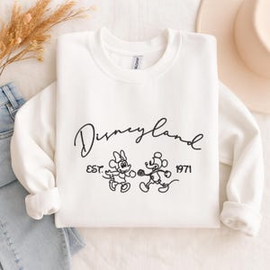 EmbroiderEmbroidered Disneyland Sweatshirt, Disney Vacation Crewneck, Disneyland Trip Hoodie, Matching Family Disneyland Sweater, Disney Fan Gifted Disneyland Comfort Colors Shirt, Mickey and Minnie Hoodie