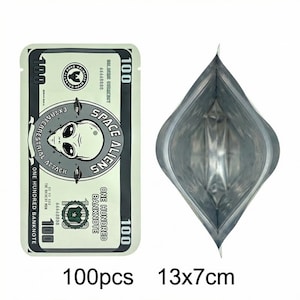 May include: A light green, rectangular package with a design resembling a &pound;100 note, featuring an alien graphic and the text "SPACE ALIENS". The package is open, revealing a silver interior. The text "100pcs 13x7cm" is at the bottom.