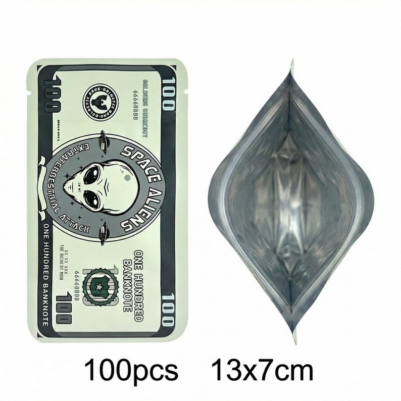 May include: A light green, rectangular package with a design resembling a &pound;100 note, featuring an alien graphic and the text "SPACE ALIENS". The package is open, revealing a silver interior. The text "100pcs 13x7cm" is at the bottom.