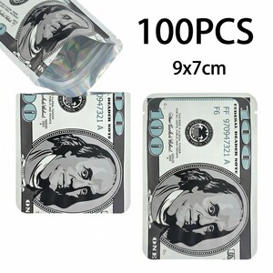 May include: A collection of 100 resealable bags, each featuring a design that mimics a $100 bill. The bags are rectangular, with dimensions of 9x7cm. The design includes a portrait of Benjamin Franklin and the text "100PCS".
