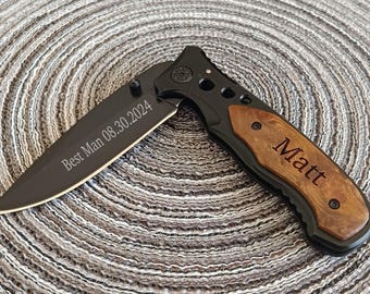 May include: A black pocket knife with a wood handle. The blade is engraved with the text "Best Man 08.30.2024" and the handle is engraved with the name "Matt".