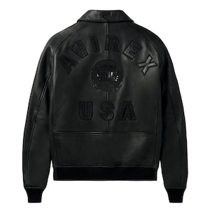 Back view of the black American flight jacket highlighting the detailed raised embossed Avirex style USA back design.