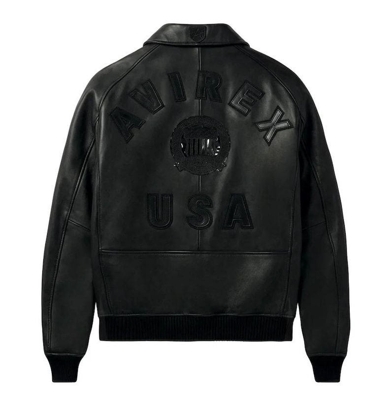 Back view of the black American flight jacket highlighting the detailed raised embossed Avirex style USA back design.