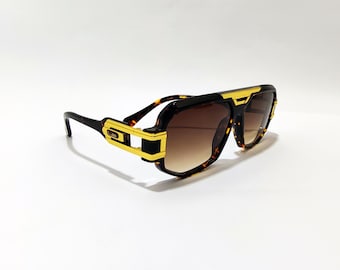 Gafas de sol Cazal con montura carey y dorada, lentes marrones, para hombre y mujer, estilo vintage.