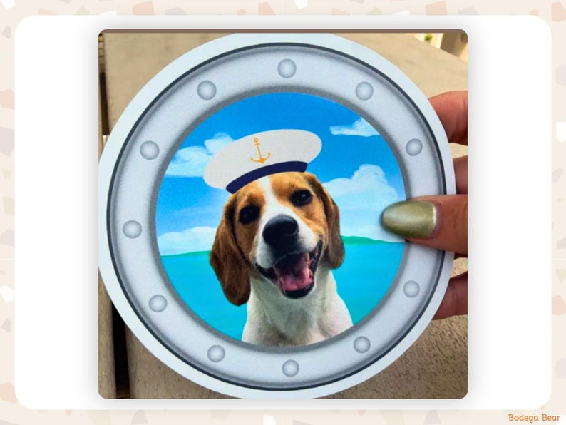 Close up of a finished porthole magnet of a beagle wearing a sailor's cap held in a woman's hand.