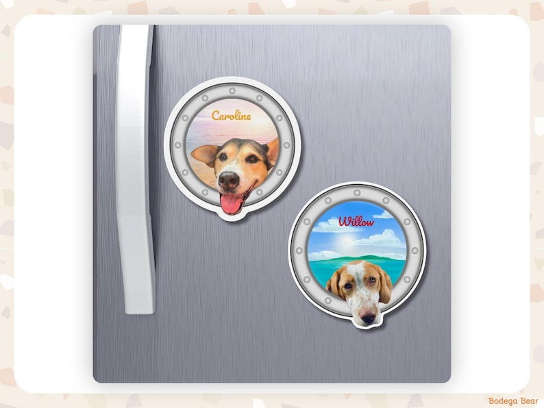 A fridge with two custom porthole magnets featuring dogs with their heads hanging over the edge. One is called Caroline and the other is called Willow.