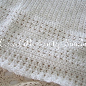 A crochet baby blanket pattern featuring a center cross design accented with a beautiful border. Easy crochet stitches. Pattern has been professionally edited. Finished size is about 28 by 32 inches. Perfect to crochet for a newborn or as a gift.