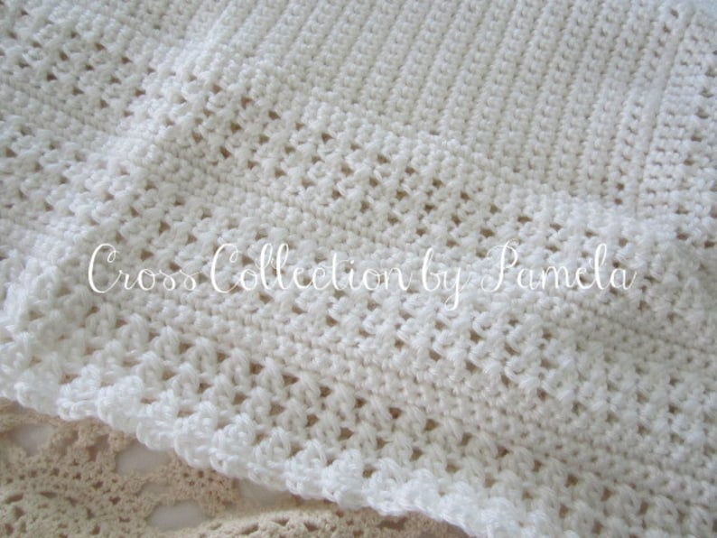 A crochet baby blanket pattern featuring a center cross design accented with a beautiful border. Easy crochet stitches. Pattern has been professionally edited. Finished size is about 28 by 32 inches. Perfect to crochet for a newborn or as a gift.