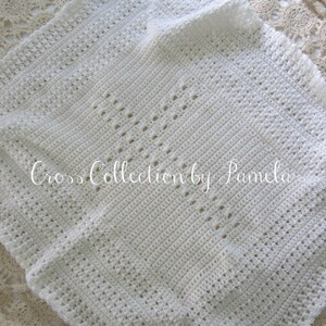 A crochet baby blanket pattern featuring a center cross design accented with a beautiful border. Easy crochet stitches. Pattern has been professionally edited. Finished size is about 28 by 32 inches. Perfect to crochet for a newborn or as a gift.
