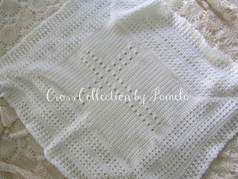 A crochet baby blanket pattern featuring a center cross design accented with a beautiful border. Easy crochet stitches. Pattern has been professionally edited. Finished size is about 28 by 32 inches. Perfect to crochet for a newborn or as a gift.
