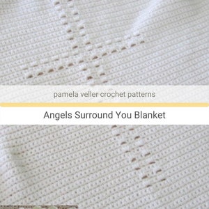 May include: White crochet baby blanket with a yellow crocheted border. The blanket has a pattern of small holes in the center, creating a star shape. The text "Angels Surround You Blanket" is printed on a yellow banner.