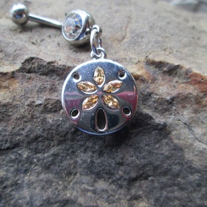 belly button ring sand dollar with gold colored stones  body jewelry piercing