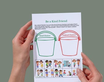 May include: A white paper with the title "Be a Kind Friend" is held by two hands. The paper has two bucket outlines, one green labeled "Kind Choices" and one red labeled "Unkind Choices". Below are illustrated choices of kind and unkind behaviors.