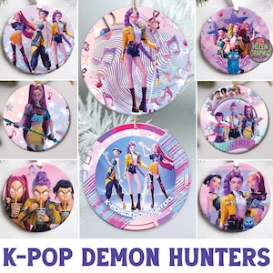 May include: A selection of round ceramic ornaments with colourful illustrations of K-Pop Demon Hunters. The designs feature anime-style characters in dynamic poses, with musical notes and stars. The ornaments have a white background and are ready to hang.