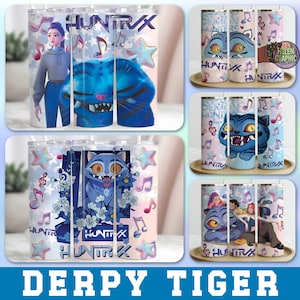 May include: Several stainless steel tumblers with colorful designs. The designs include a blue cartoon cat, musical notes, stars, and the text "HUNT RX". The tumblers are on a tray with a light wood finish. The bottom of the image has the text "DERPY TIGER".