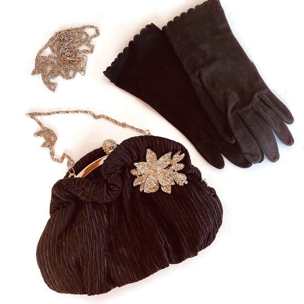 A vintage  1940s black set of gloves and a jeweled purse with adjustable handles