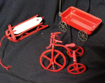 Vintage red metal transportation ornaments sold individually