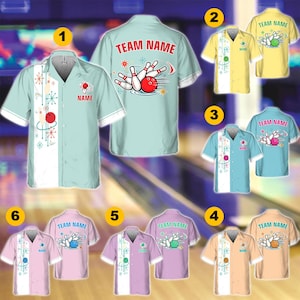 May include: A collection of short-sleeved button-down bowling shirts in various pastel colors, each featuring a white vertical panel with a retro starburst pattern, a bowling ball, and pins graphic, with customizable text areas labeled TEAM NAME.