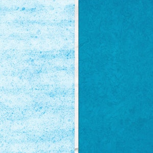 May include: A textured blue background with a white vertical line down the center. The left side of the background is a lighter shade of blue with a grainy texture. The right side of the background is a darker shade of blue with a more marbled texture.