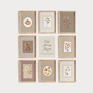 Puede incluir: Una colección de nueve láminas de pared enmarcadas con ilustraciones de temática otoñal de calabazas, hojas y flores en tonos neutros. Una tarjeta central muestra el texto Cozy Autumn Prints y Lana Cozy Printables en una fuente cursiva.