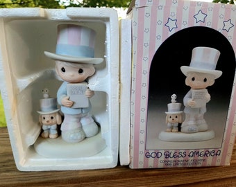 Precious Moments Sam Butcher Enesco Co Vintage 1986 Ltd Ed title "God Bless America" Commemorative Closed Edition Orig Box orig Tags Packing