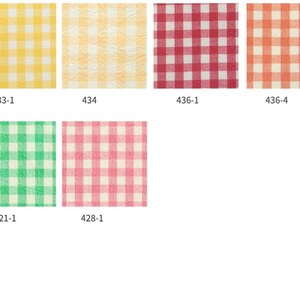 May include: A collection of fabric swatches featuring a classic gingham pattern in various colors. The swatches include yellow, peach, red, orange, green, and pink, each with a white grid overlay. Each swatch is labeled with a number.