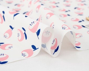 May include: White fabric with a repeating pattern of pink stylized flowers with blue stems and leaves.