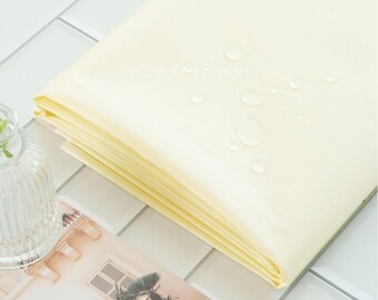 Waterproof Fabric | Cream Yellow Washed Cotton with Non-Toxic TPU Lamination, 150cm (59”) Wide, Made in Korea by the Yard (TPU-999691)