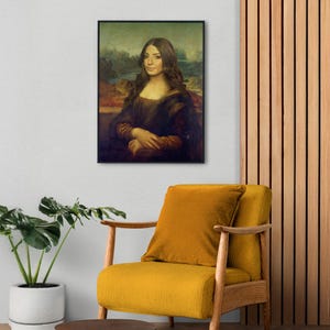 May include: A framed portrait of a woman with brown hair and a neutral expression, styled in the manner of the Mona Lisa painting. The background is a landscape with a river and trees.