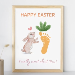 以下が含まれることがあります： オレンジ色の文字で「ハッピーイースター」と書かれた白いカード。漫画のウサギが、緑の葉のついたニンジン型の足跡を見ている。カードの下部にピンク色の文字で「本当にニンジンが好きです！」と書かれている。