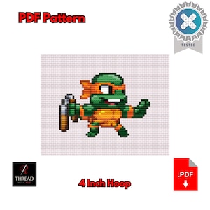 May include: A cross-stitch pattern featuring a pixelated Teenage Mutant Ninja Turtle character in green and orange, holding a weapon. The text "PDF Pattern" and "4 inch Hoop" are displayed. The design is "Tested".