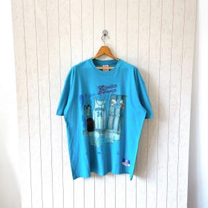 Vintage 90s Charlotte Hornets t-shirt/ vintage Hornets NBA t-shirt/ vintage Nutmeg mills X CCM t-shirt/ size XL