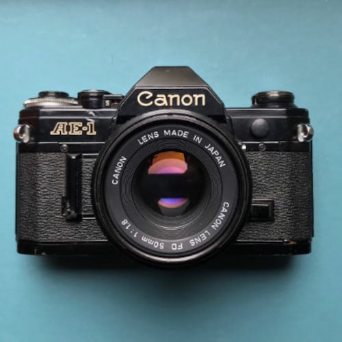 Canon A-1 35mm SLR Film Camera Body - Taos Estate Sales, Taos Black Dog