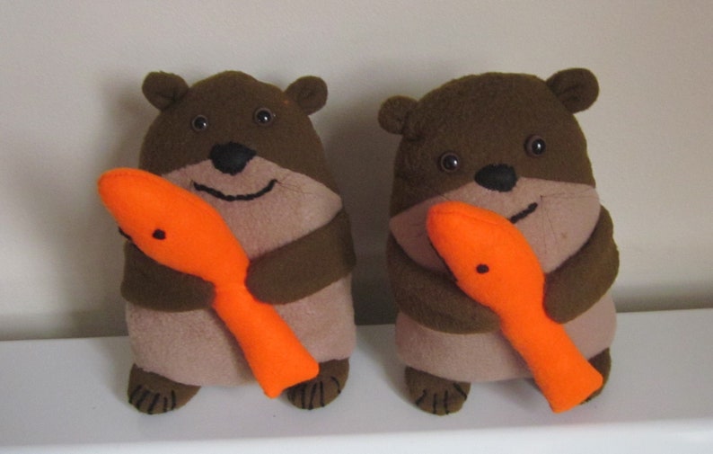 NEW Brown Otter Twins with Orange Fish Cuddly Toys Brown image 0