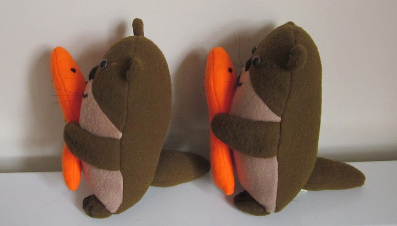 NEW Brown Otter Twins with Orange Fish Cuddly Toys Brown image 2