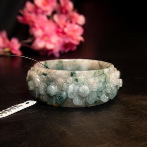 62MM Natural Grade A Burmese Jade Bracelet– Ice White, Green & Translucent | 27mm Thick | Hand-Carved Pikul Flower Motif – Amulet Luck Stone
