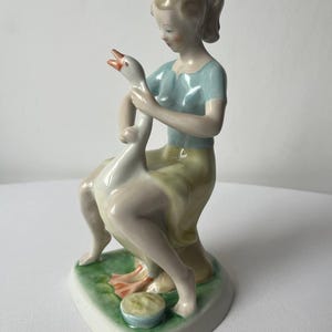 Vintage porcelain figurine of a young woman and a goose ( Hollohaza, Hungary, 1960s)