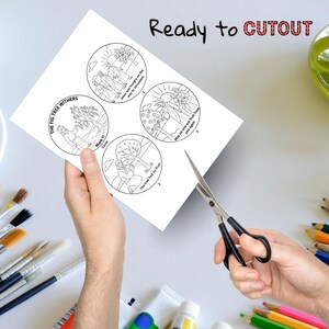 May include: A white sheet of paper with four circular illustrations, each depicting a scene from a biblical story, held by a person. The text "Ready to CUTOUT" is at the top. Scissors are cutting the paper. Paintbrushes and colored pencils are in the background.