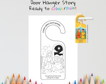 May include: A white door hanger with a black and white illustration of a biblical scene. The text reads "Samuel Hears God's Voice" and "Ready to colour/Paint". The design includes a young boy and the text "Listen when God speaks."