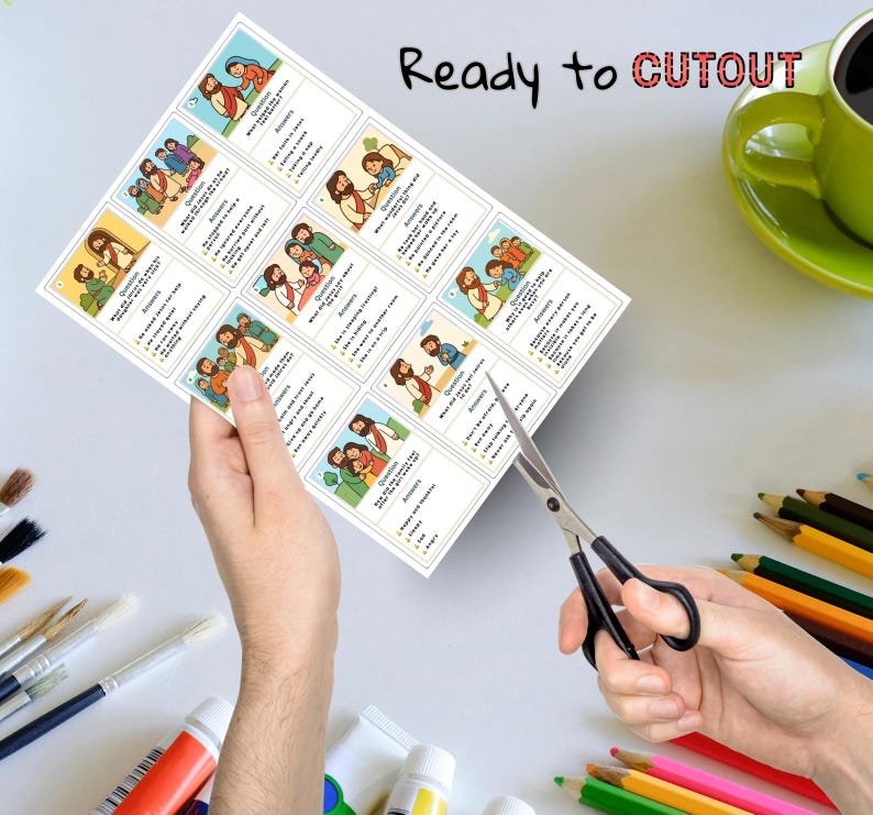Puede incluir: Una hoja de tarjetas impresas con ilustraciones y texto, que se corta con tijeras. Las tarjetas presentan dibujos coloridos de personas y texto sobre un fondo blanco. Las palabras "Ready to CUTOUT" est&aacute;n impresas en la parte superior.